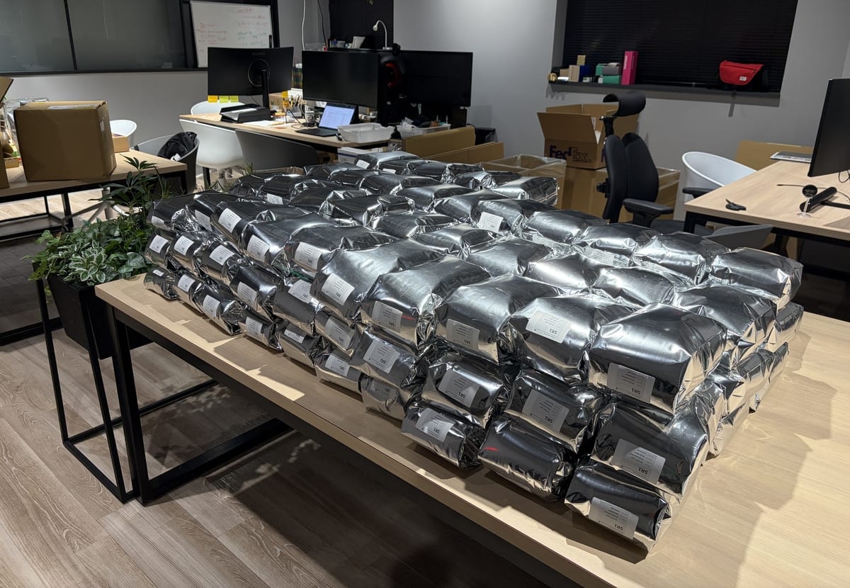 Silver bags of matcha stacked on a table in the RIKYU Tokyo office
