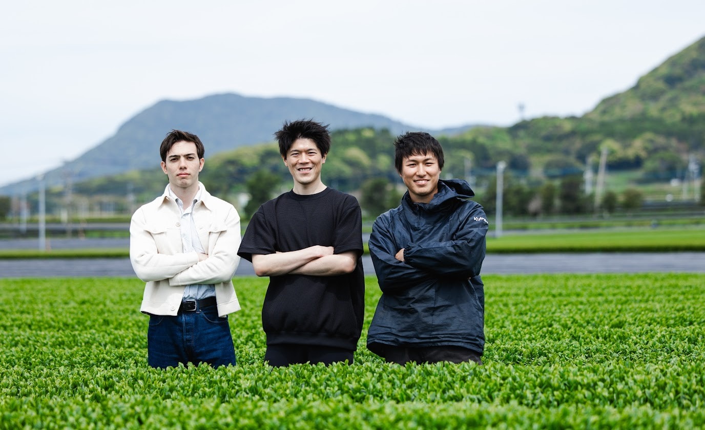 The RIKYU team standing in a tea field
