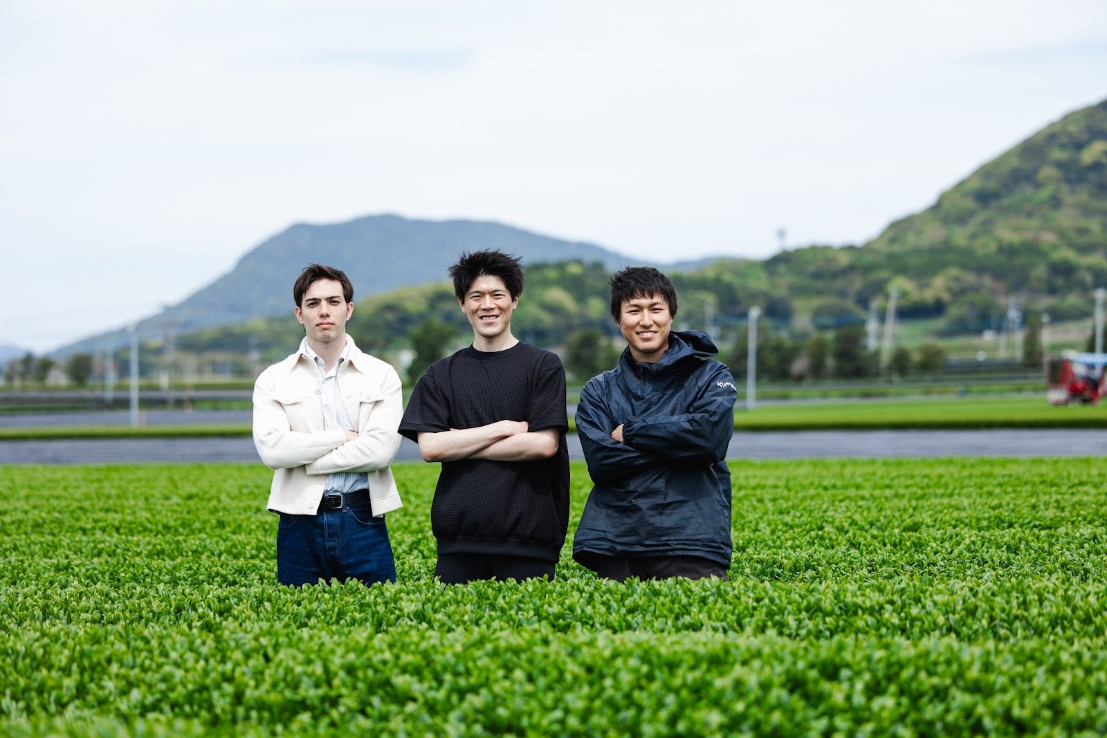 The RIKYU team standing in a tea field