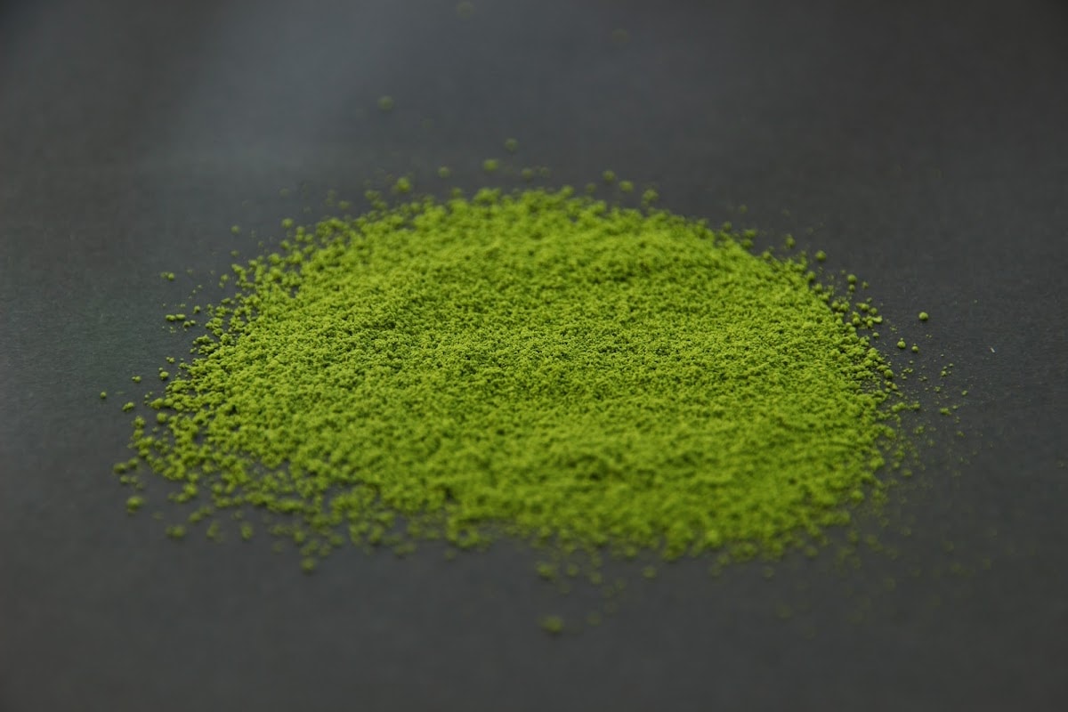 Shizuoka A matcha powder heaped on a dark surface